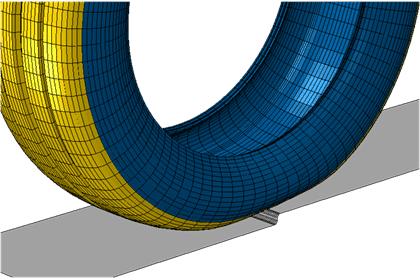 A blue and yellow tire on the ground.