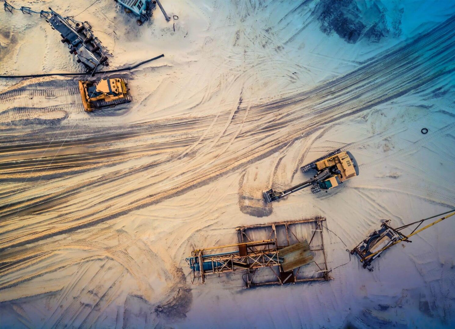 Aerial view of excavators and conveyor at quarry