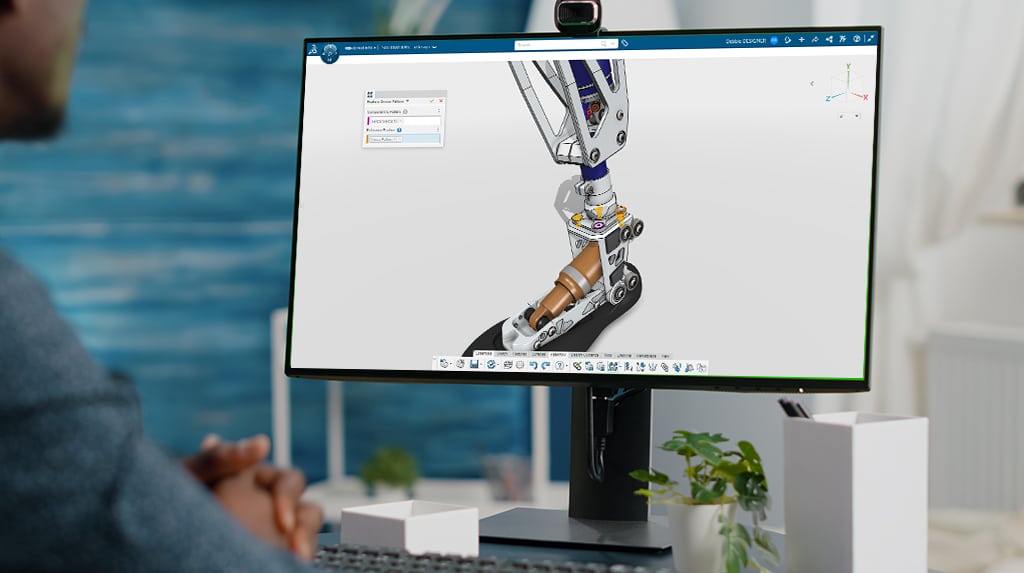 Engineer viewing 3D robotic leg CAD model