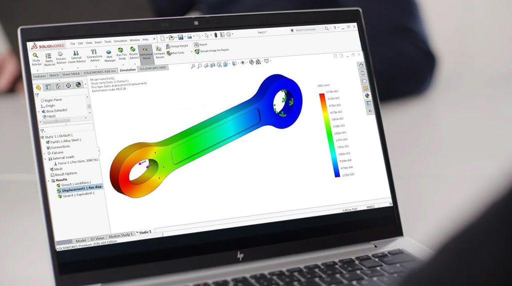 Laptop displaying SolidWorks FEA stress map