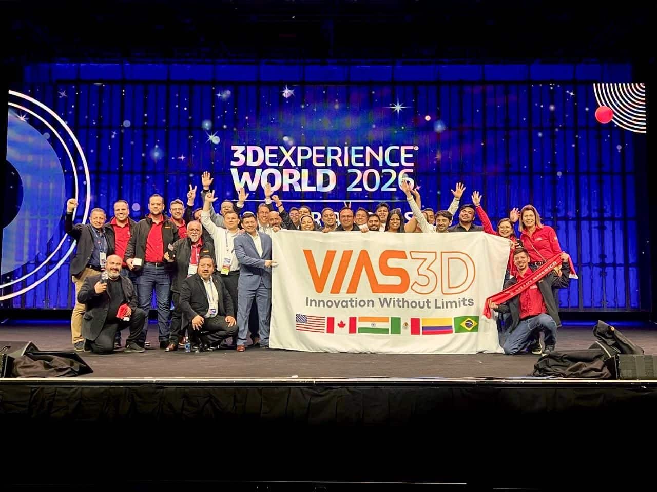 Group on stage holding VAS3D banner