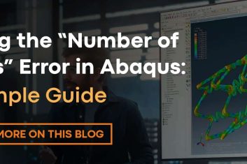 A man standing in front of a computer screen.