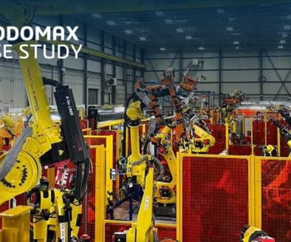 A large warehouse filled with yellow and red machines.