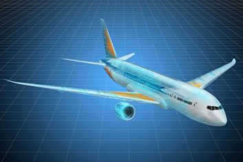 A plane flying through the air with its wings extended.